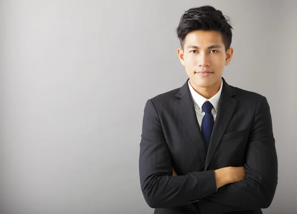 Jonge lachende Aziatische zakenman — Stockfoto