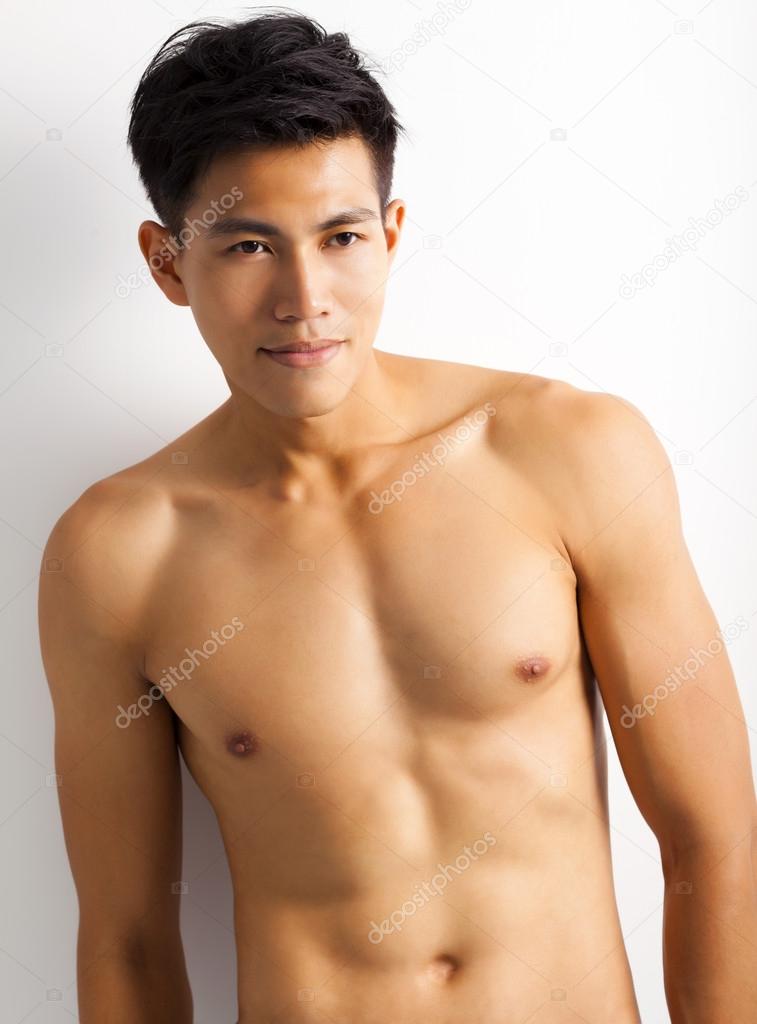 asian young sport man with perfect fitness body