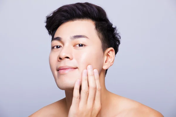 Closeup charming and smiling young man face — Stock Photo, Image