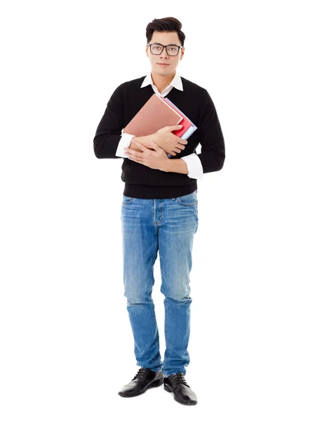 Retrato de comprimento total de sorrir menino da escola segurando livros — Fotografia de Stock