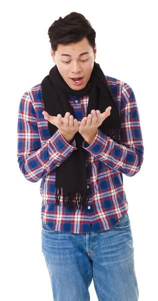 Surprised  young man looking his hands — Stock Photo, Image