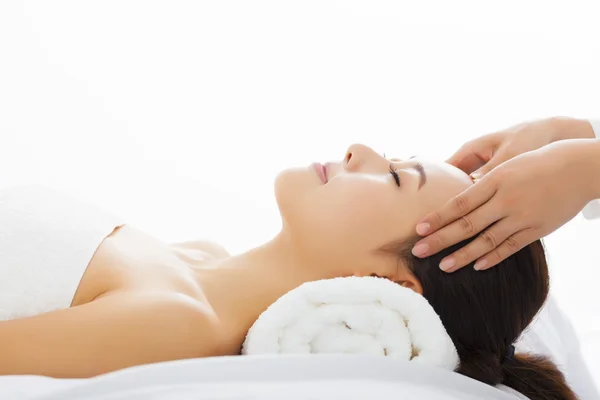 Young  woman getting spa treatment over white background — Stock Photo, Image