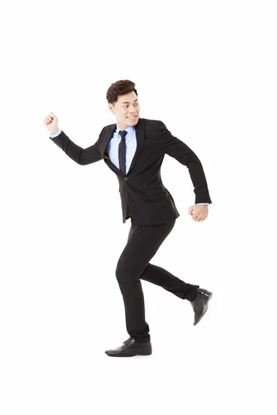 Businessman running and looking back — Stock Photo, Image