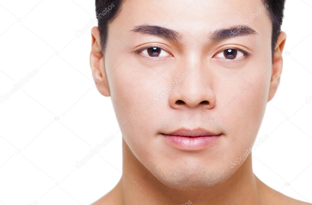 closeup young  asian man face isolated on white