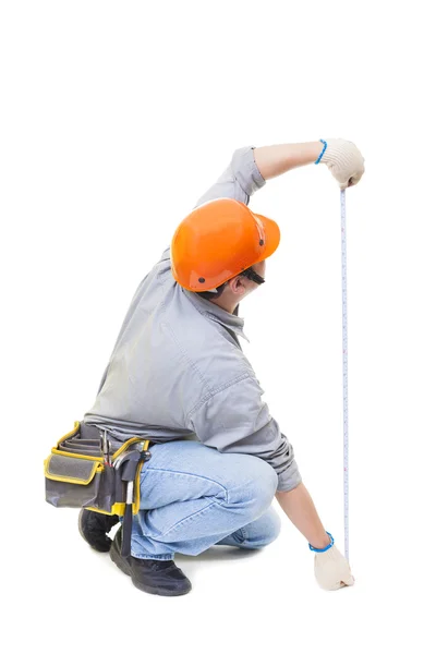 Worker with a tape measure isolated on white — Stock Photo, Image