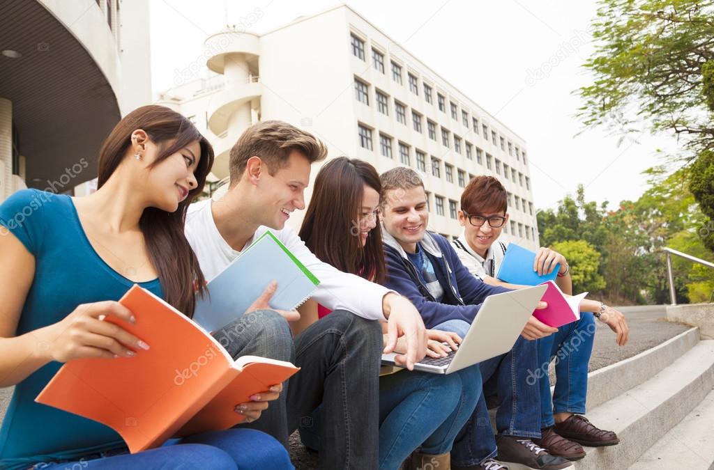 young group of university students studying