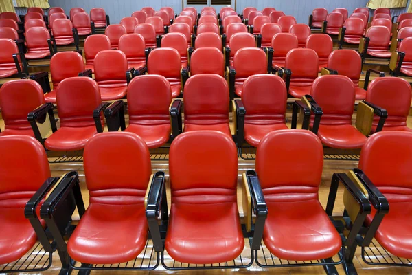 Interior of empty conference hall with red chairs — Stock Photo, Image