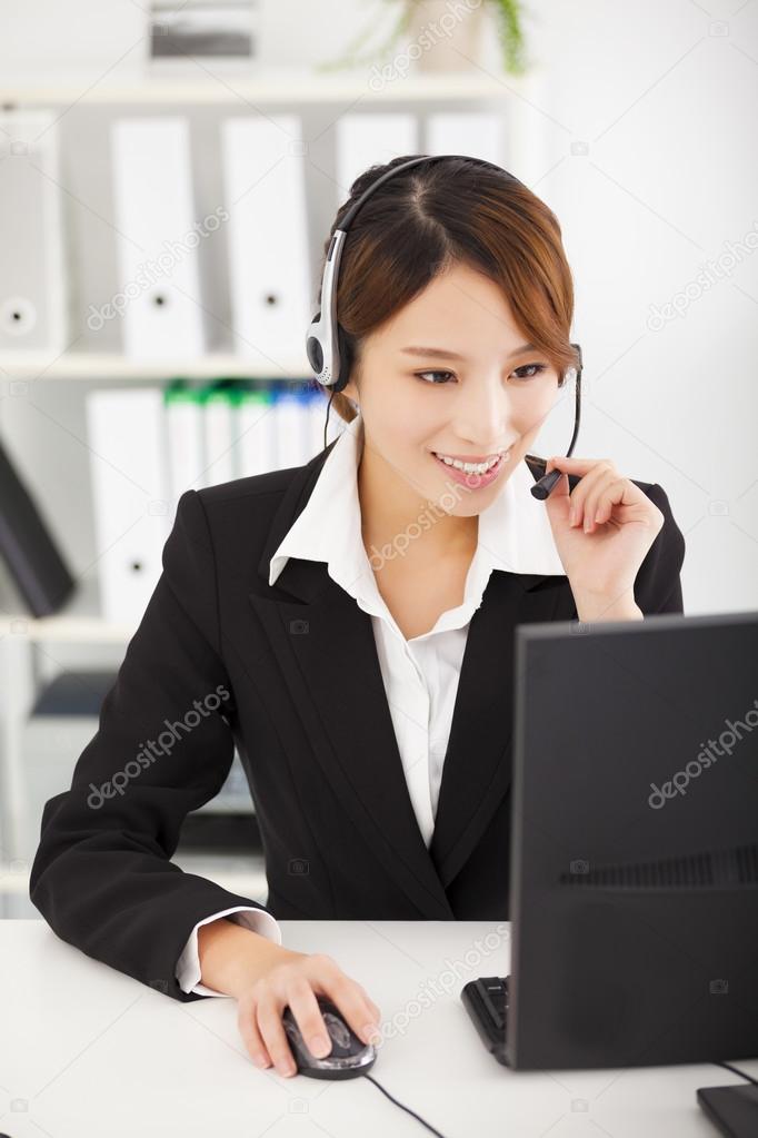 young  businesswoman with headset working in office