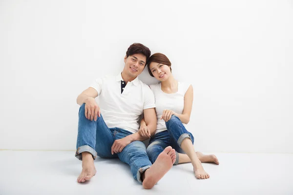 Happy Young Couple Sitting On Floor — Stock Photo, Image