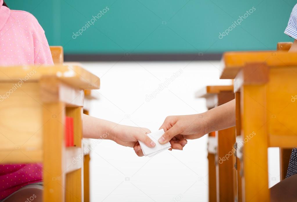 Students passing notes in the classroom