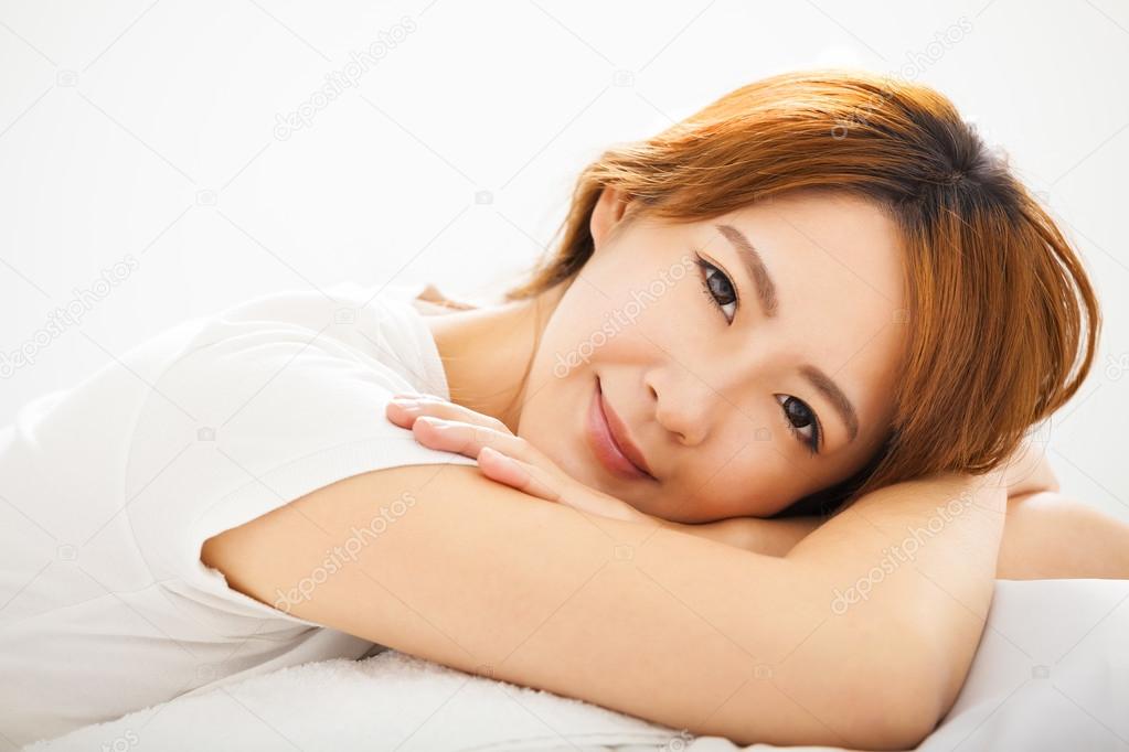 Attractive young beautiful Woman Waking Up In Bed