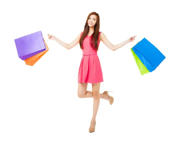 Mujer joven con bolsas aisladas en blanco —  Fotos de Stock