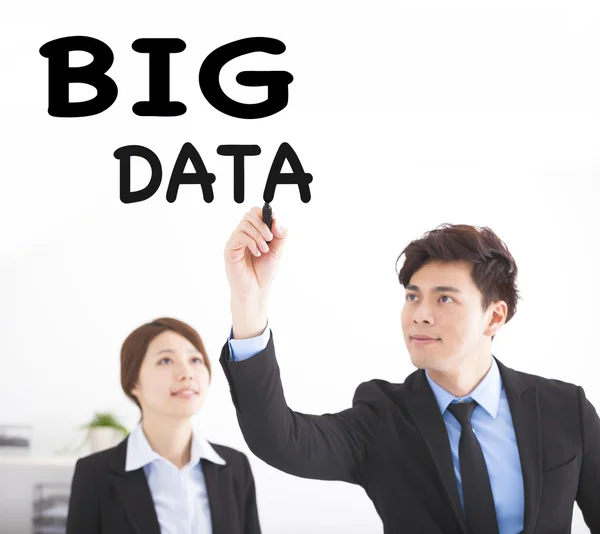 Business people drawing big data text in office — Stock Photo, Image