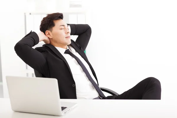 Relaxed Young businessman  in the  office — Stock Photo, Image