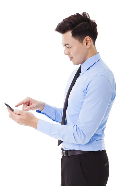 Young smiling businessman with smart phone — Stock Photo, Image