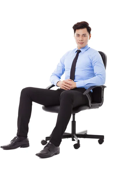 Young businessman sitting in a chair isolated — Stock Photo, Image