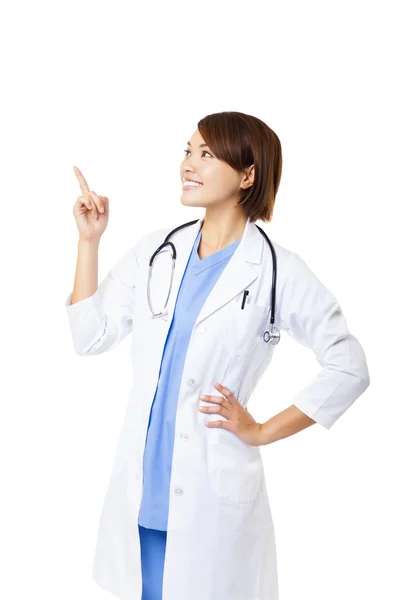 Smiling medical doctor woman pointing — Stock Photo, Image