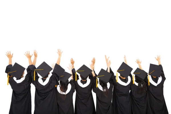 Achteraanzicht van studenten vieren afstuderen — Stockfoto