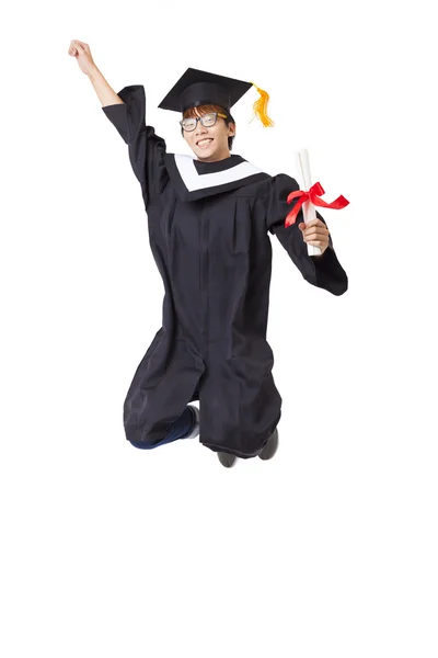 Estudiante feliz en bata de graduado saltando sobre fondo blanco —  Fotos de Stock