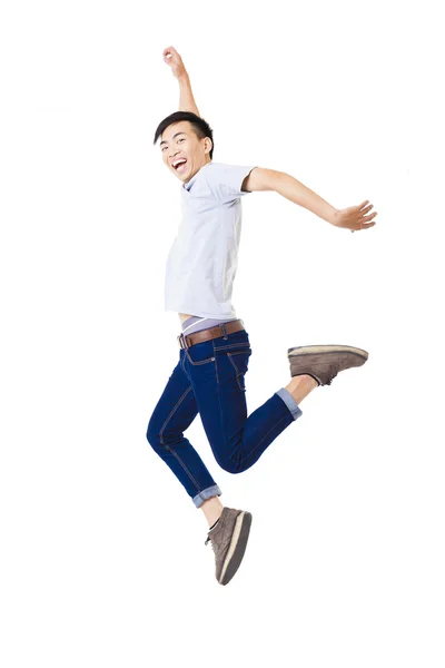 Joven feliz hombre saltando y aislado en blanco —  Fotos de Stock