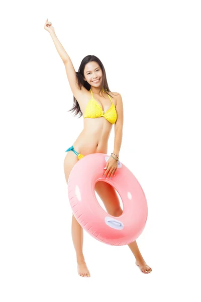 Sexy female in bikini holding swimming ring — Stock Photo, Image