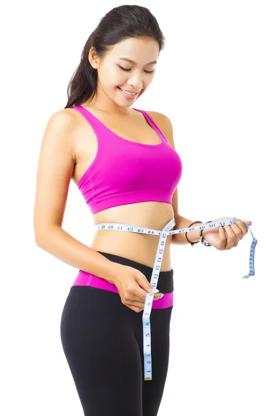 Young smiling woman with measure tape — Stock Photo, Image