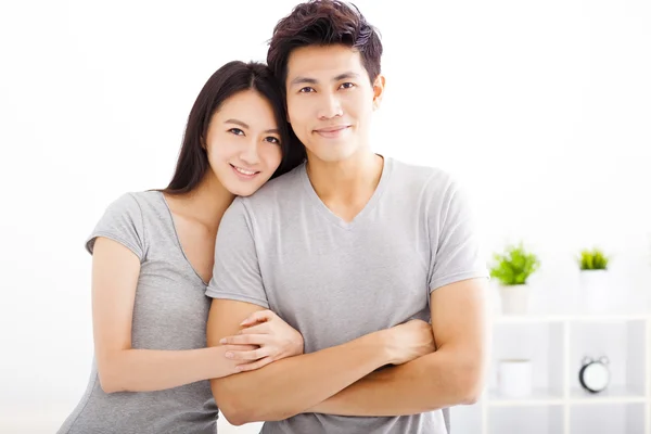 Young happy couple hugging and smiling — Stock Photo, Image