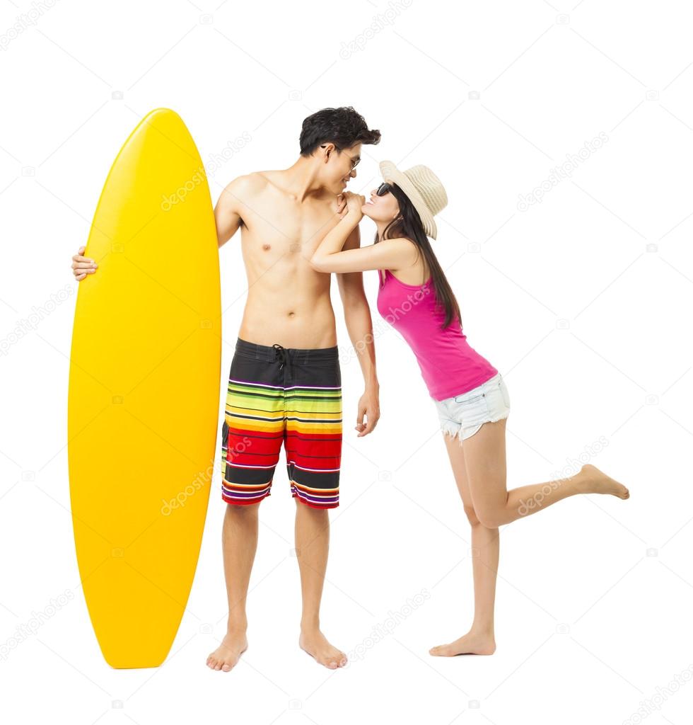 full length young surfer with girlfriend