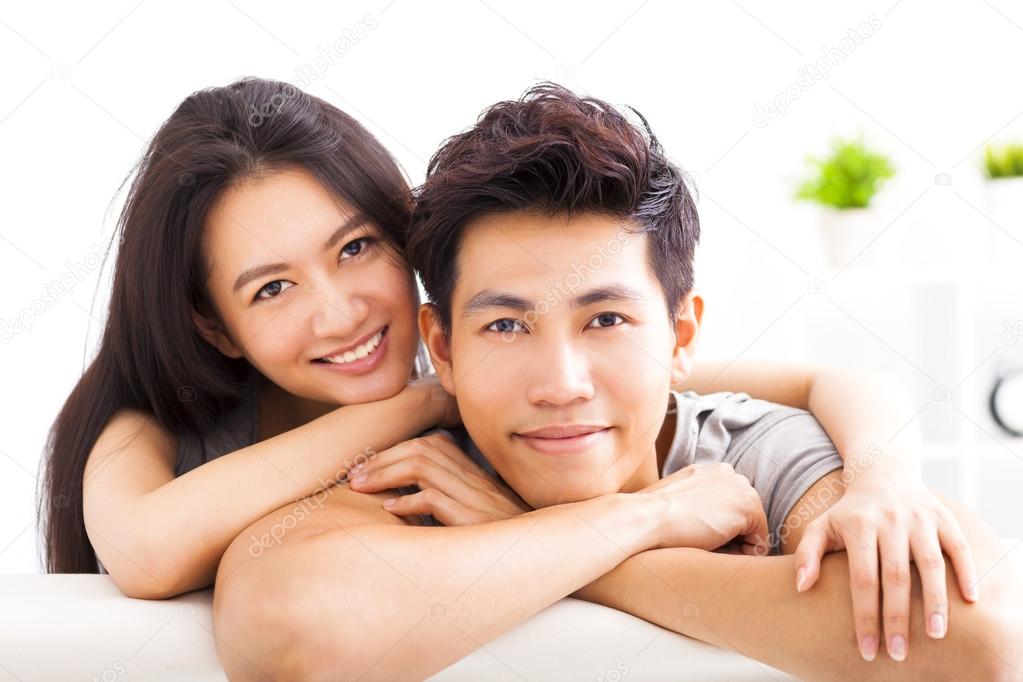 Young happy couple hugging and smiling