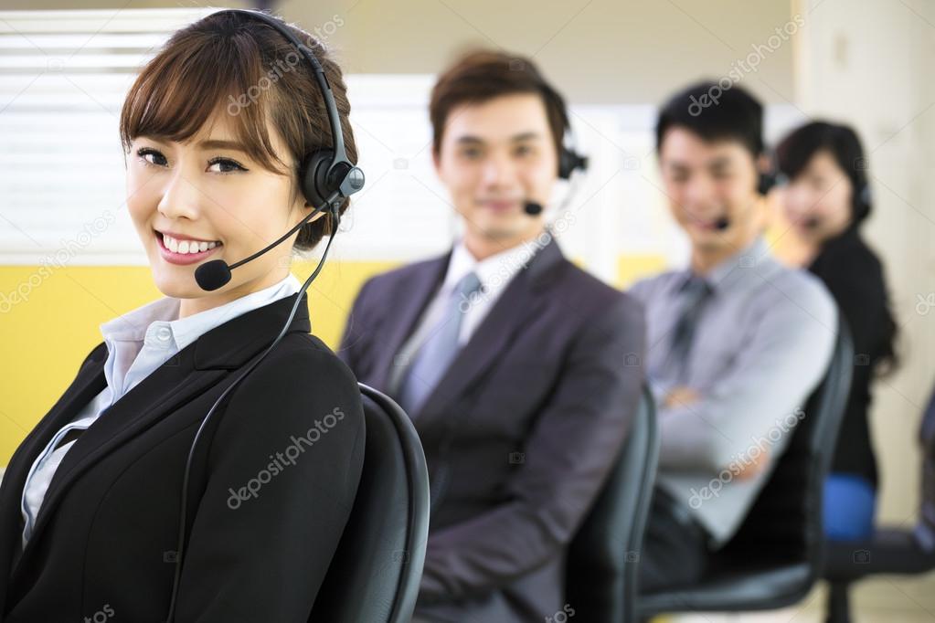 Young business team working with headset in office