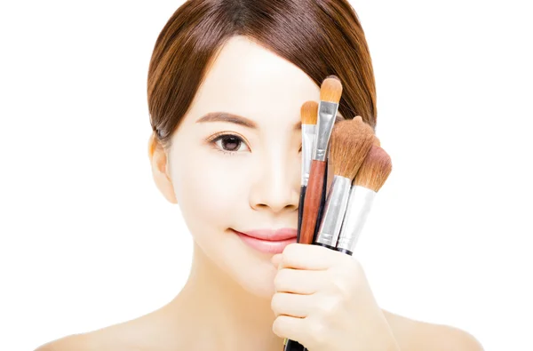 Young beautiful woman with Makeup Brush — Stock Photo, Image