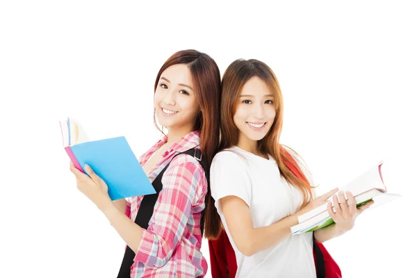 Dois adolescentes felizes estudantes meninas isoladas em branco Imagem De Stock