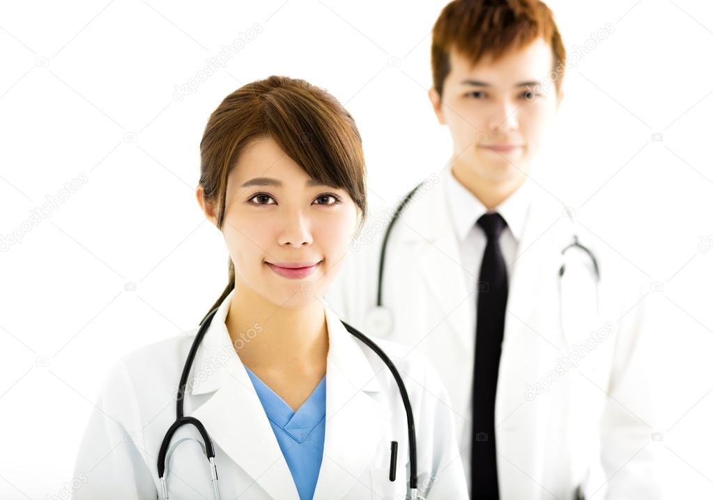 smiling male and female doctors standing together