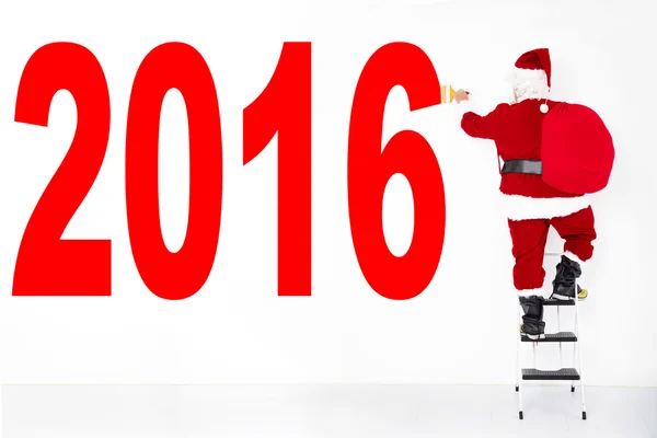 Jultomten målning 2016 på den vita väggen — Stockfoto