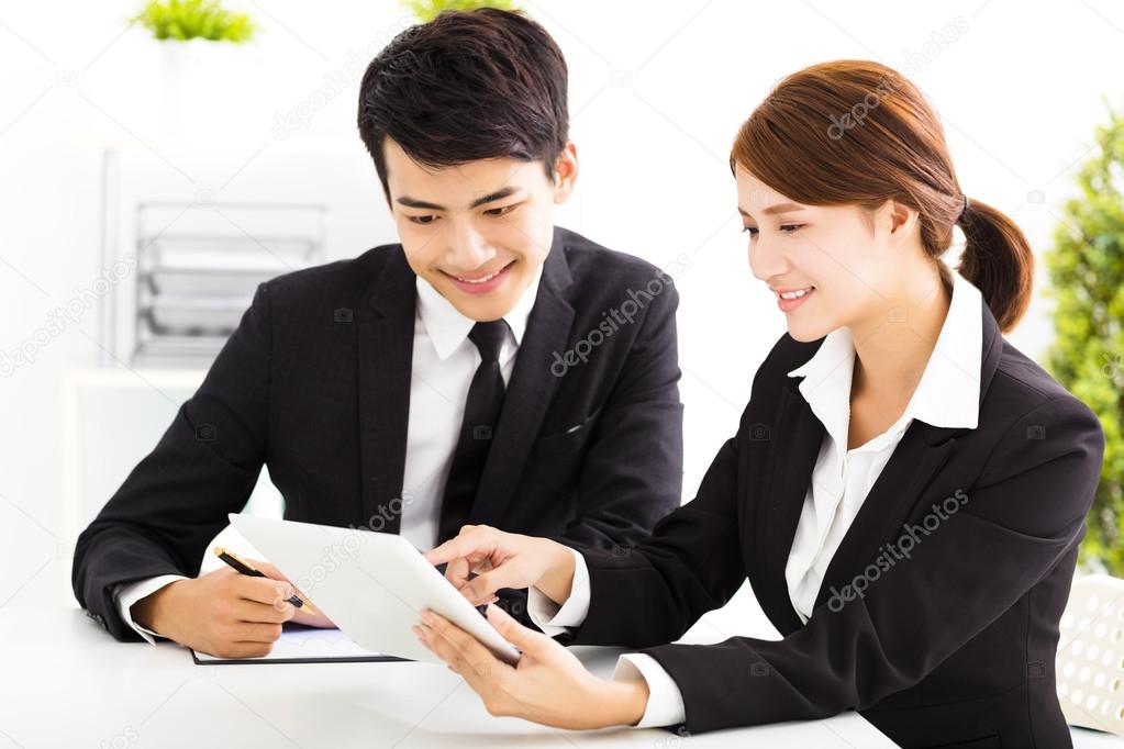 happy business man and woman working  in office