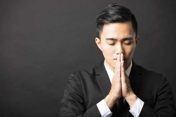 Young business man with pray gesture — Stock Photo, Image