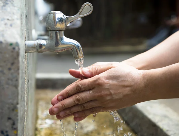 Washing of hands  under running water outdoor — Stock Photo, Image