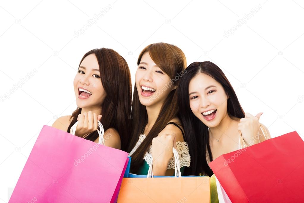 Group of happy young woman with shopping bags