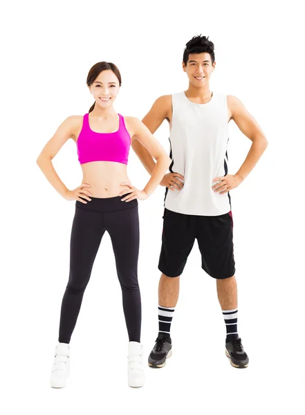 Jovem casal fitness de pé juntos isolado no branco — Fotografia de Stock