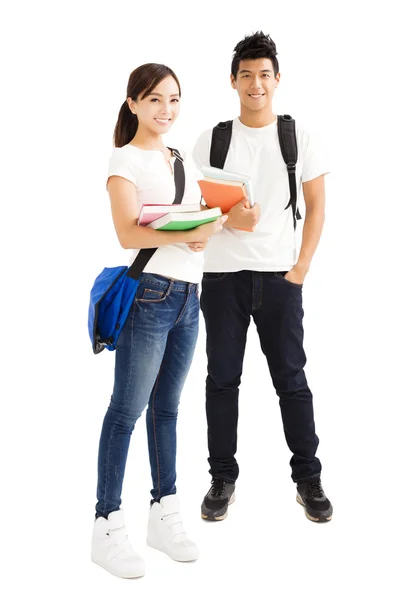 Glückliche junge Studenten paaren sich mit Büchern — Stockfoto