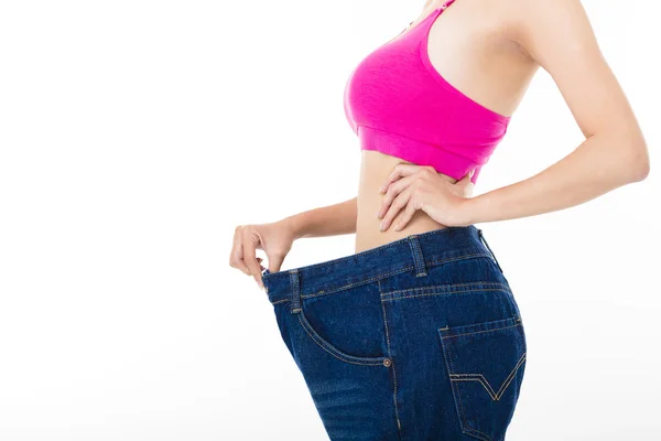 Belle jeune femme mince avec de gros jeans — Photo