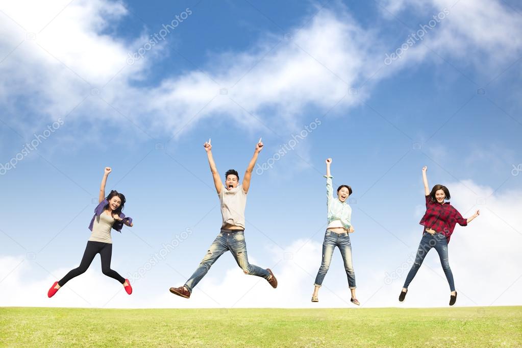 happy young group jumping together