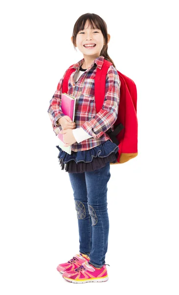 Full length of smiling little girl holding books — Stock Photo, Image