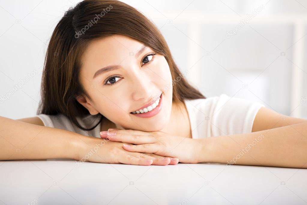 relaxed young smiling woman  in living room