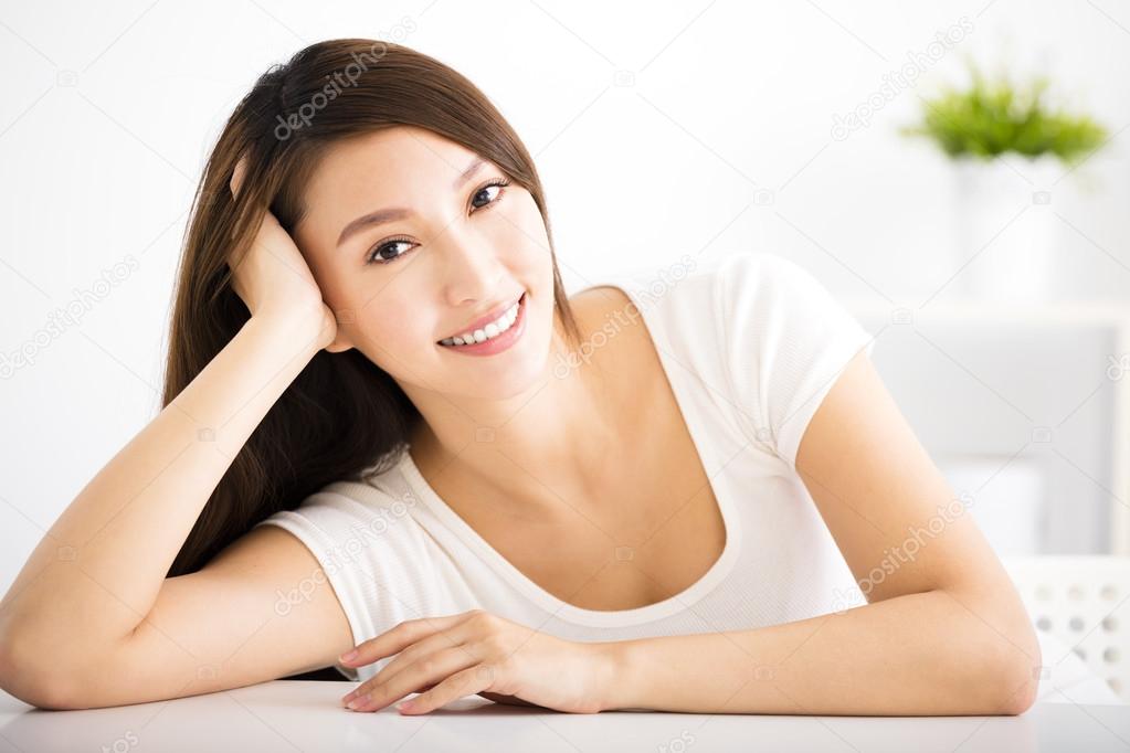 relaxed young smiling woman  in living room