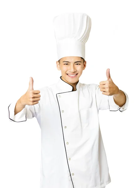 Young  male chef with thumb up isolated on white Stock Photo