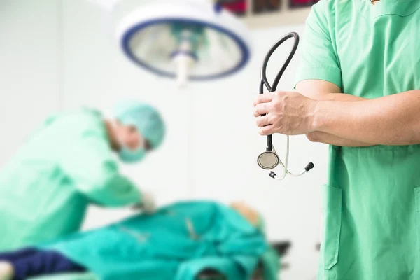 Doctor working in surgical operating room and surgeon concept — Stock Photo, Image