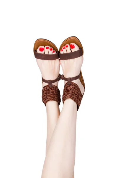 Woman legs wearing of sandals — Stock Photo, Image