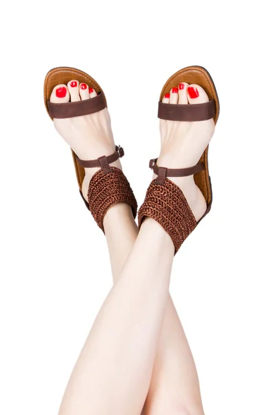 Woman legs wearing of sandals — Stock Photo, Image