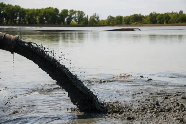 Discharge of waste through a pipe directly into water bodies